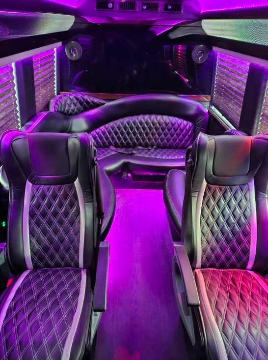 Luxury vehicle interior with quilted leather seating and ambient lighting