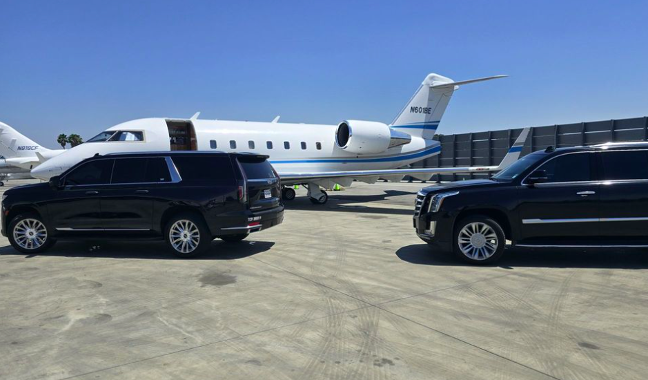 Luxury SUVs beside a private jet